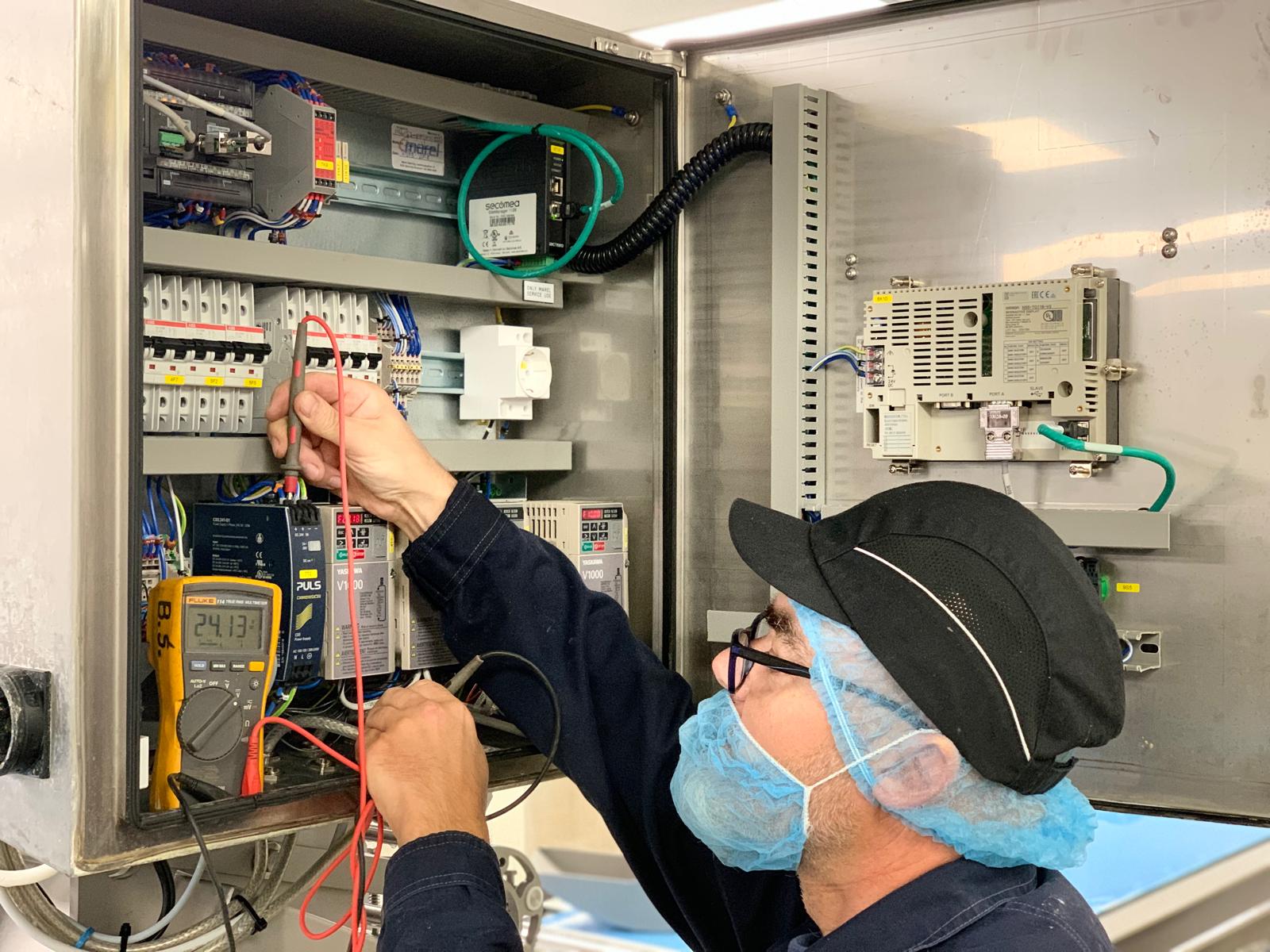 Technician performing maintenance check